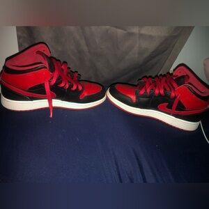 These are Jordan 1mid”Black/Fire Red/white shoes size 5.5